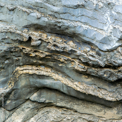 Close up view of natural wavy rochy formation. Abstract rough design photo