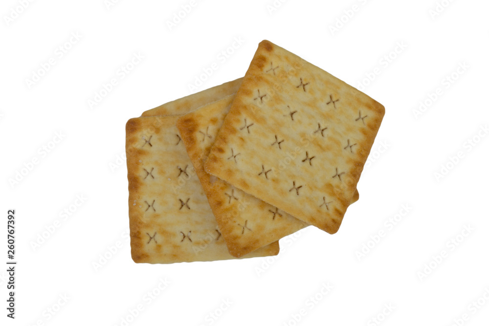 Cracker biscuits over white background. Selective focus Cracker biscuits over white background. Selective focus