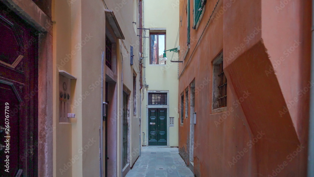 14732_The_tall_buildings_on_a_narrow_streets_in_Venice_in_Italy.jpg