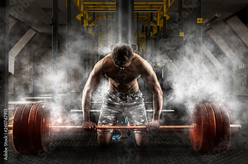 Man workout with barbell photo