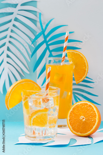 Orange juice in glass and fresh fruits