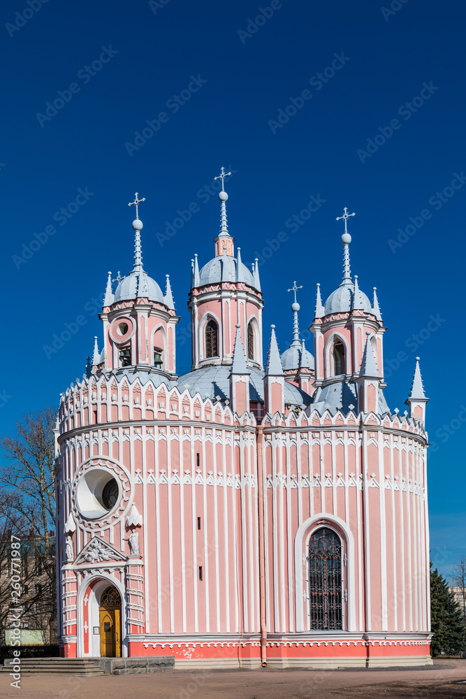 The detached alone red and white Chesme Church in Saint Petersburg, Russia in a sunny day on the background of clear blue sky