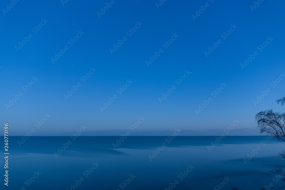 Obraz premium Calm Baltic sea in the morning. View from the sandy cliff