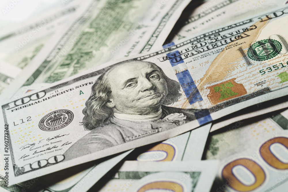 American dollars. A stack of hundred dollar bills. Close up American dollars. A stack of hundred dollar bills. Close up