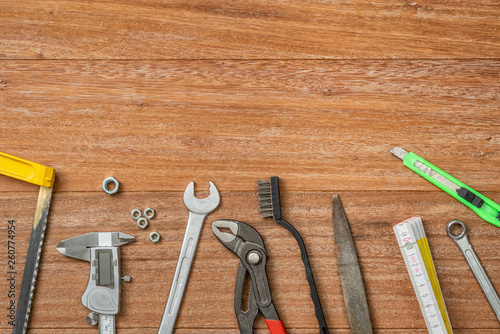 Tools on a wooden background with copy space