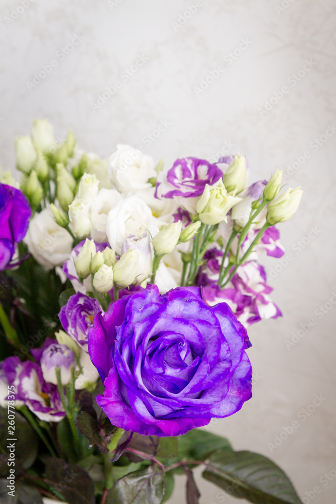 A beautiful bouquet of fresh pink roses in an expensive vase