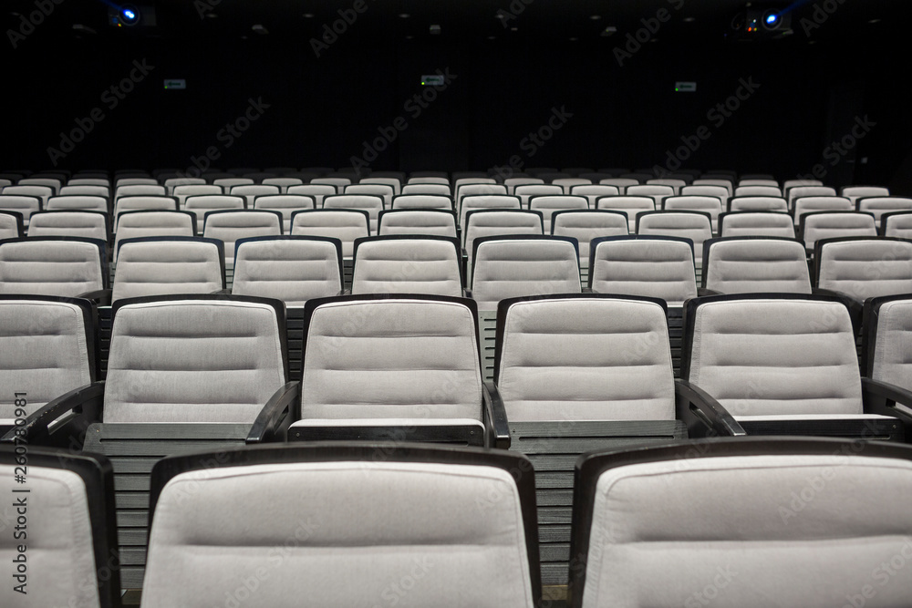 Empty grey seats in theatre or conference Empty grey seats in theatre or conference