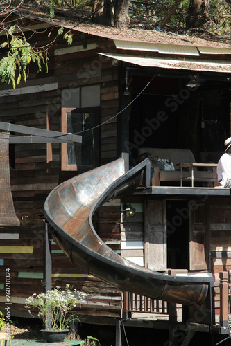 An abandoned old water slide in the park.