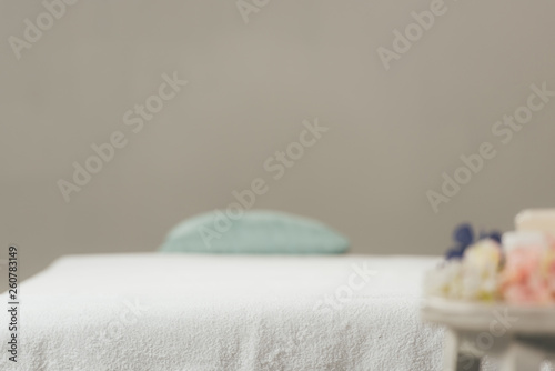Fototapeta Naklejka Na Ścianę i Meble -  selective focus of massage table with white towel in spa