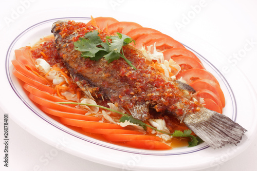 Grilled Whole Fish with Tomatoes and Chili Sauce - Fresh Mediterranean Seafood Dish, Rustic Food Presentation on White Background
