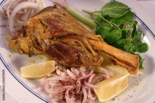 Braised Lamb Shank with Onions, Lemon, and Vegetables - Rustic Mediterranean Meat Dish, Gourmet Food Photography