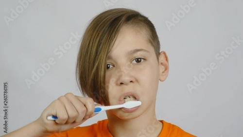 Wallpaper Mural boy brushing his teeth with a toothbrush Torontodigital.ca