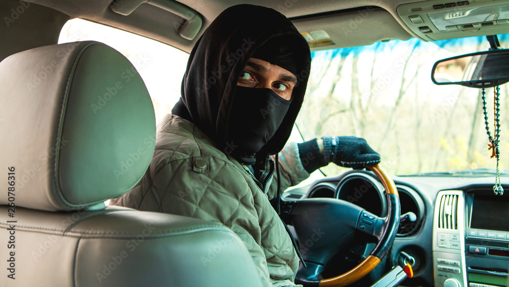 carjacking, the thief sits behind the wheel