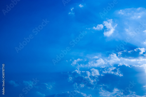 Blue sky with clouds, fluffy white cloud on air clear blue sky weather background texture.