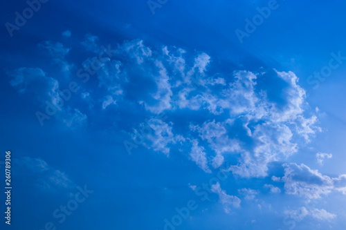 Blue sky with clouds, fluffy white cloud on air clear blue sky weather background texture. © Nutt