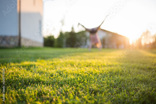 lawn at home. child in blur. On a Sunny summer day.