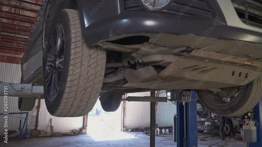 custom made wallpaper toronto digitalMechanic inspects a car chassis on the car lift