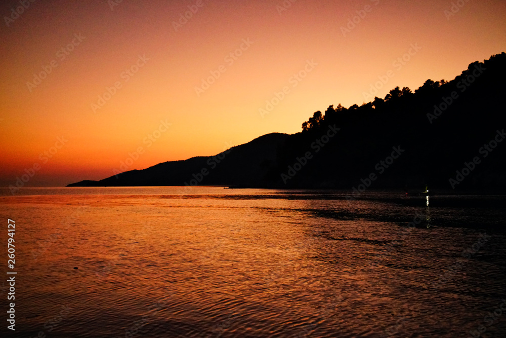 Sunset above a beach on Skopelos Island, Greece