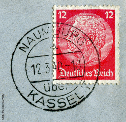 Naumburg, Kassel, Germany - March 12 1940: German historical stamp: Paul von Hindenburg on a blue postal envelope with black ink cancellation, Germany, the Third Reich