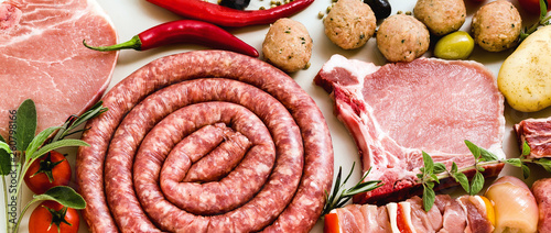 Homemade Italibanner of Homemade Italian sausage with other meats, ready to be cooked on the grill. Mediterranean recipesan sausage with other meats, ready to be cooked on the grill. Mediterranean  photo