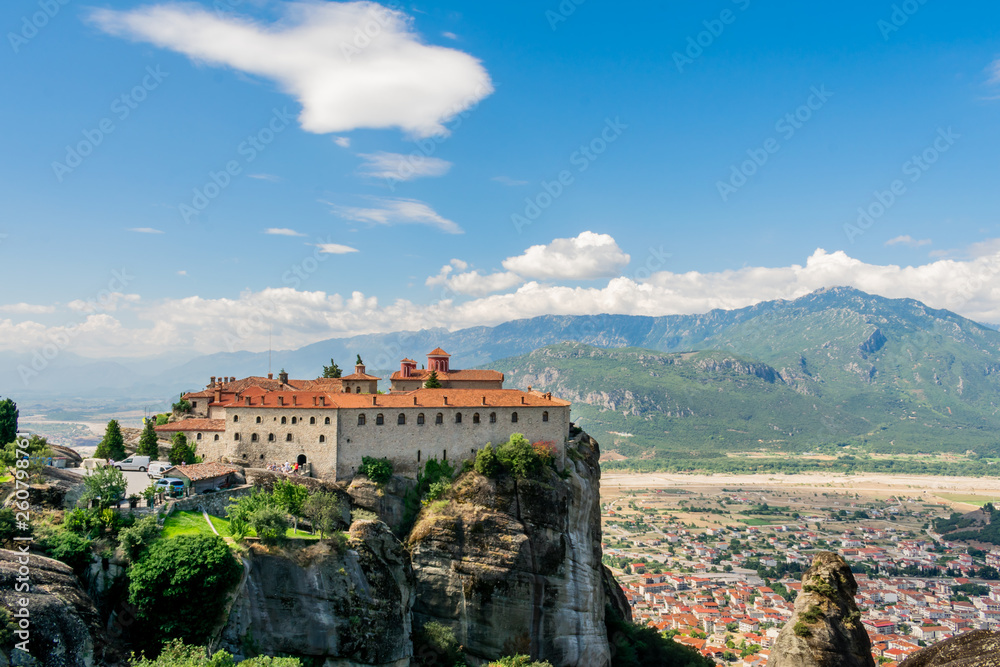 St Stefan Monastery in Meteora rocks, in Trikala, Greece. Touristic destination. Beautiful blue sky with clouds in the background