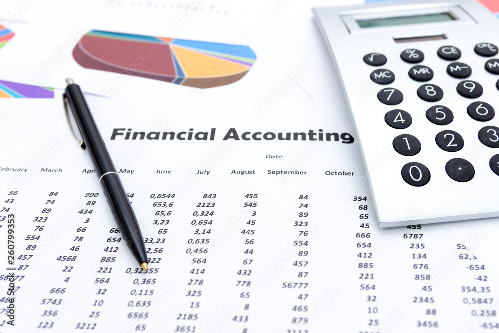 calculator and stationery items on the table, Financial accounting. calculator and stationery items on the table, Financial accounting.