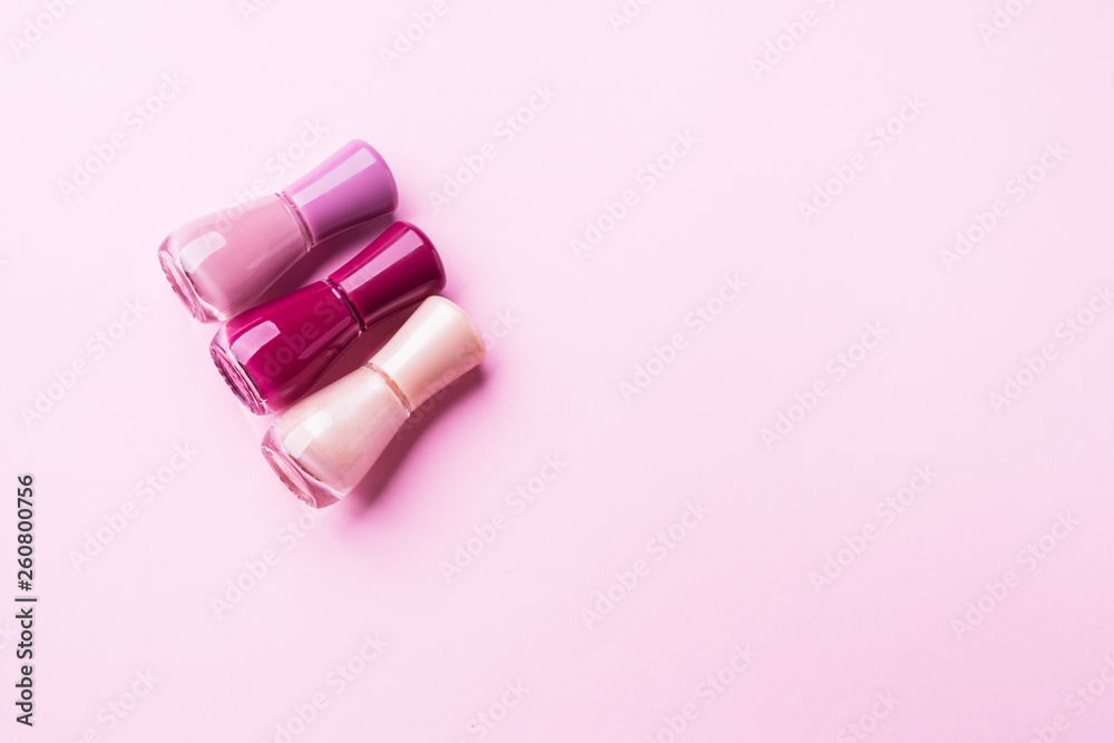 Pink nail polishes on monochrome background Pink nail polishes on monochrome background