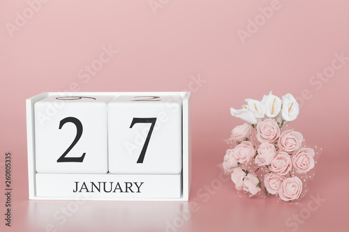 January 27th. Day 27 of month. Calendar cube on modern pink background, concept of bussines and an importent event. photo