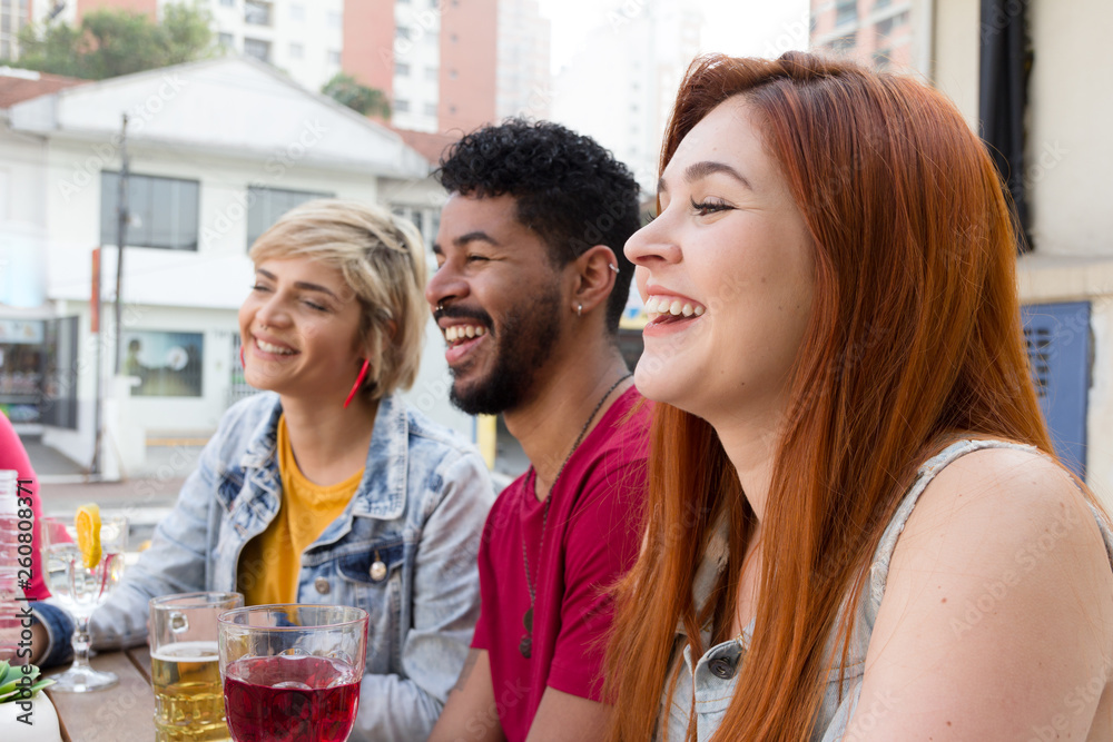 Cheerful young friends cheering and drinking together at cafe bar outdoor. Spring, warm, togetherness, lifestyle, diversity concept Cheerful young friends cheering and drinking together at cafe bar outdoor. Spring, warm, togetherness, lifestyle, diversity concept