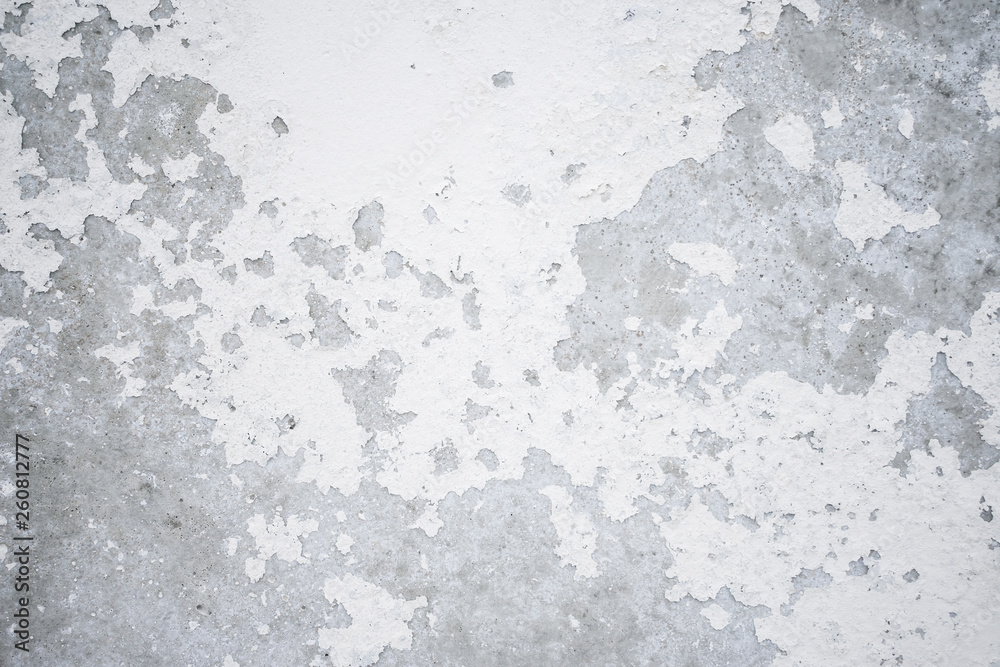 Grey wall texture with cracked old white paint