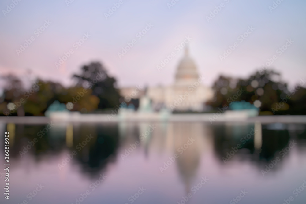 Out of Focus of The United States Capitol Building, seen from reflection pool on dusk. Washington DC, USA.