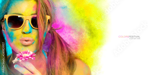 Beautiful young woman covered in rainbow colored powder. Colors festival. Beauty spring concept