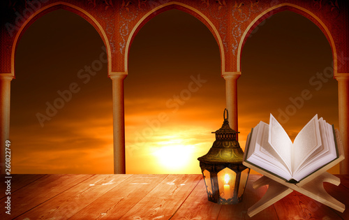 Islamic Greeting Cards for Muslim Holidays. Ramadan Kareem background.Eid Mubarak, greeting background with сolorful lantern.Quran on a wooden book stand