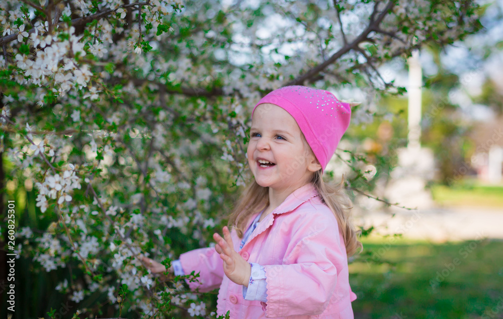girl, pink hat and jacket, flowering trees, smile girl, pink hat and jacket, flowering trees, smile