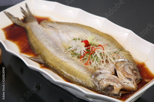 fried fish in tomato sauce