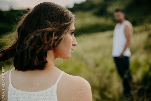 Fotografie Frustrated young woman looking in distance, think about relationships, sitting s