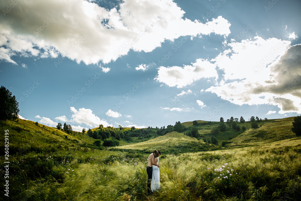 Naklejka premium Love Couple in love romantic road summer field happy. Russia. lake aslykul