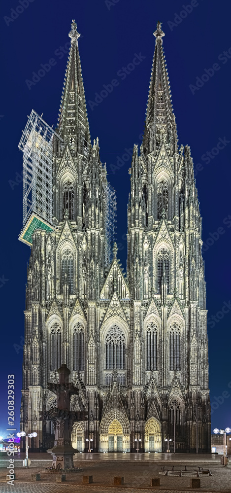 Cologne Cathedral at dusk, Germany. Construction of the Cathedral began in 1248. Currently it is the tallest twin-spired church at 157 m (515 ft) tall.