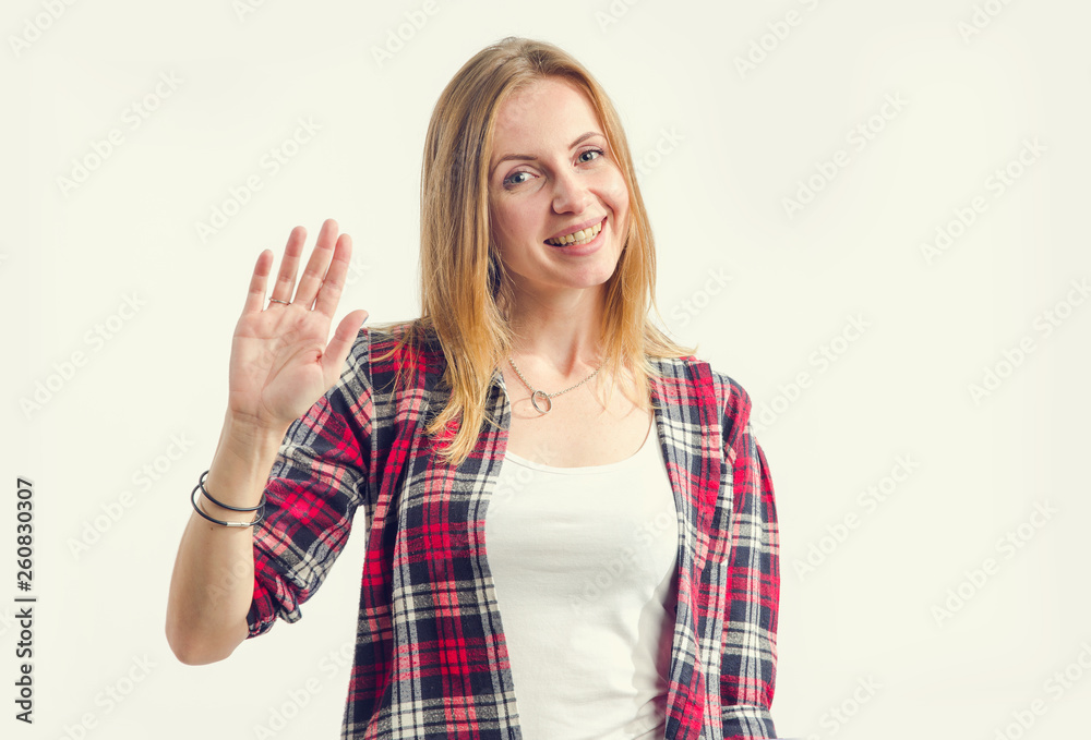 Hello, friends! Happy young woman with a smile on her face fallen hand in greeting. Hello, friends! Happy young woman with a smile on her face fallen hand in greeting.