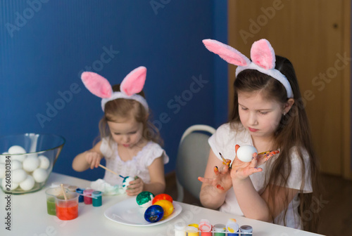  Girls paint easter eggs