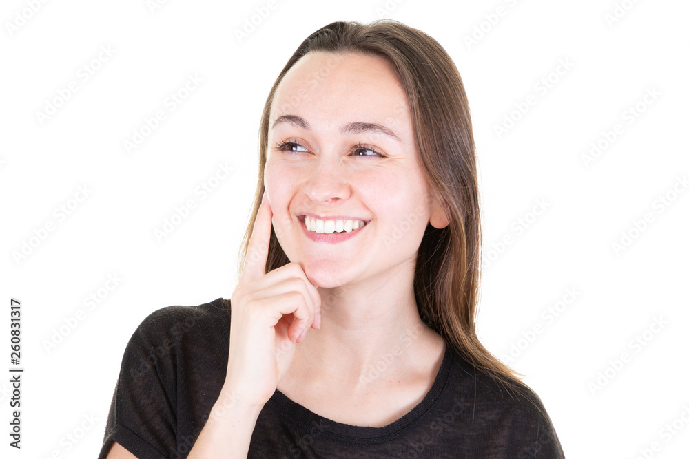 Portrait of beautiful cute young woman with smile sensual lips thinks about new idea and looking at something on white side Portrait of beautiful cute young woman with smile sensual lips thinks about new idea and looking at something on white side