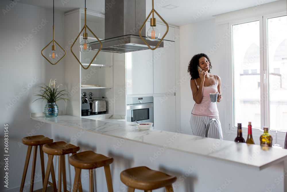 Woman having breakfast with mobile phone Woman having breakfast with mobile phone