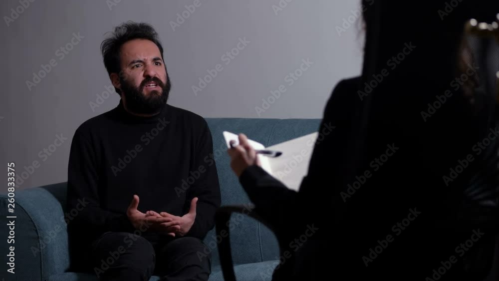 portrait of nervous man sitting during therapy at the psychologist- anxiety, stress,panic portrait of nervous man sitting during therapy at the psychologist- anxiety, stress,panic