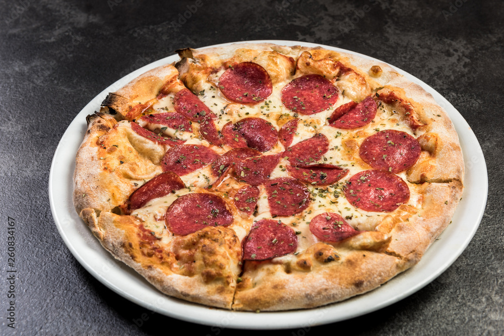 Stone baked pizza cut in slices Stone baked pizza cut in slices