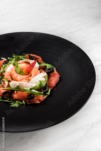 Fresh salad.Concept for a tasty and healthy meal. White stone background.