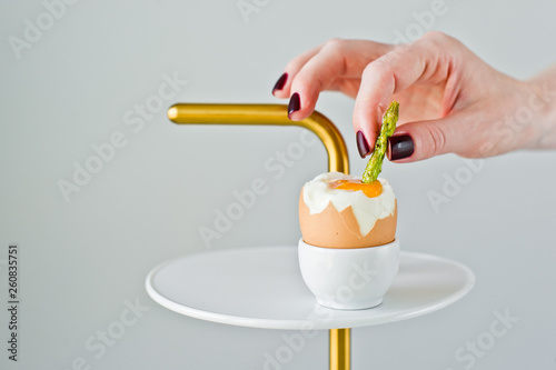 The concept of cooking eggs and asparagus.