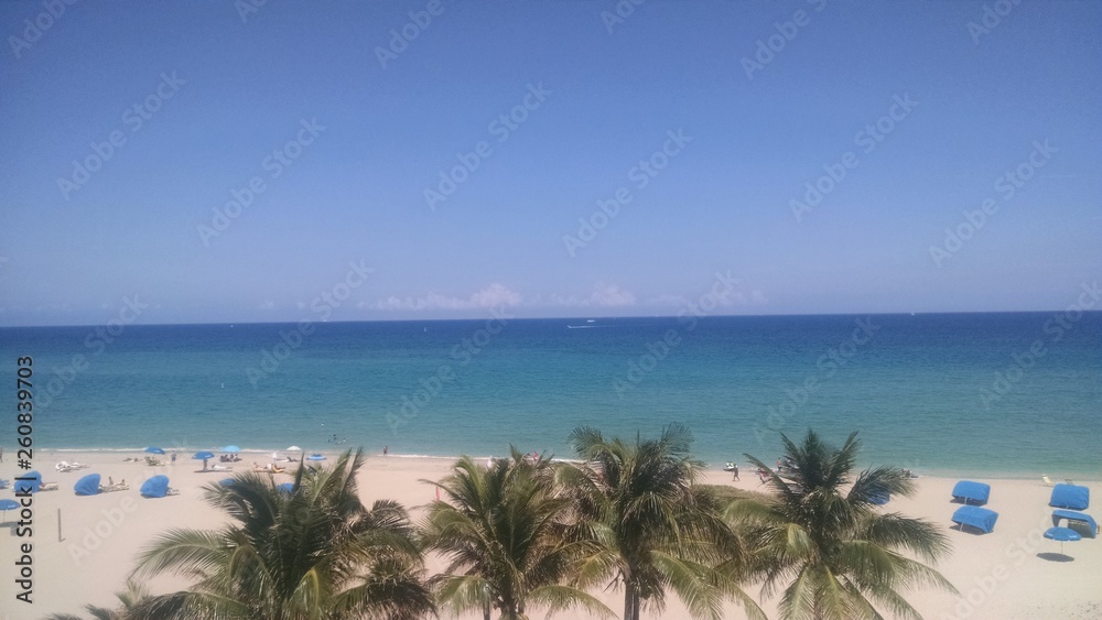 POMPANO BEACH, FL/USA – CIRCA MAY 2017 – People enjoy a sunny day at the beach at Pompano Beach, Florida. POMPANO BEACH, FL/USA – CIRCA MAY 2017 – People enjoy a sunny day at the beach at Pompano Beach, Florida.