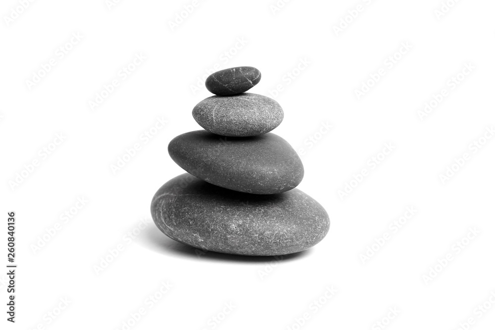 Stacked smooth grey stones. Sea pebble. Balancing pebbles isolated on white background Stacked smooth grey stones. Sea pebble. Balancing pebbles isolated on white background