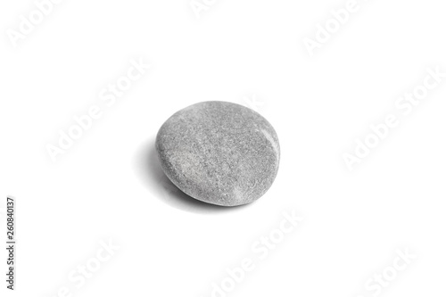 Single grey pebble isolated on white background. Smooth gray sea stone