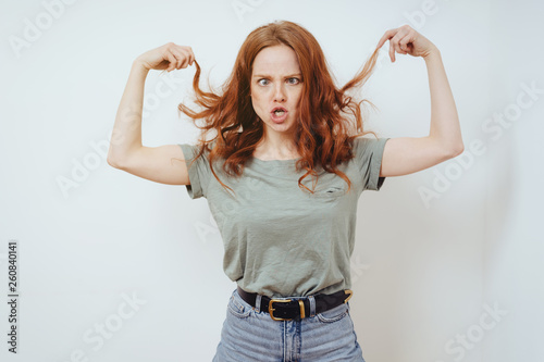Frustrated young woman pulling at her hair
